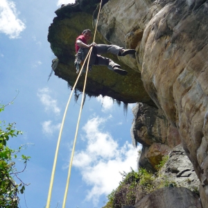 Rapelling down a rock wall in Suesca